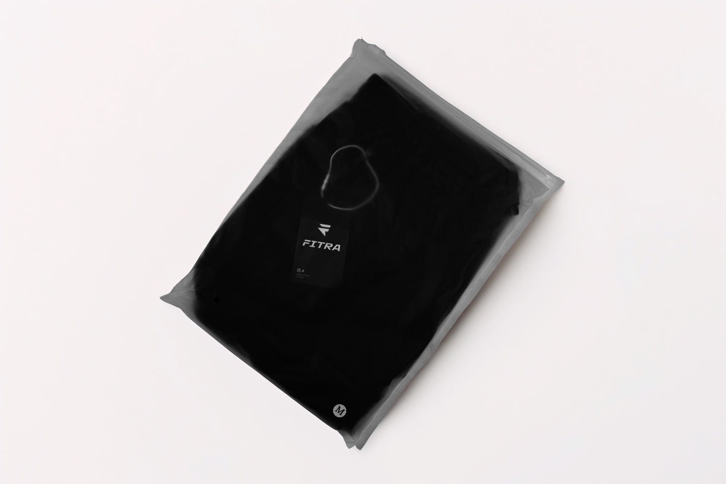 Fitra Core Short folded in sealed branded packaging with size M label