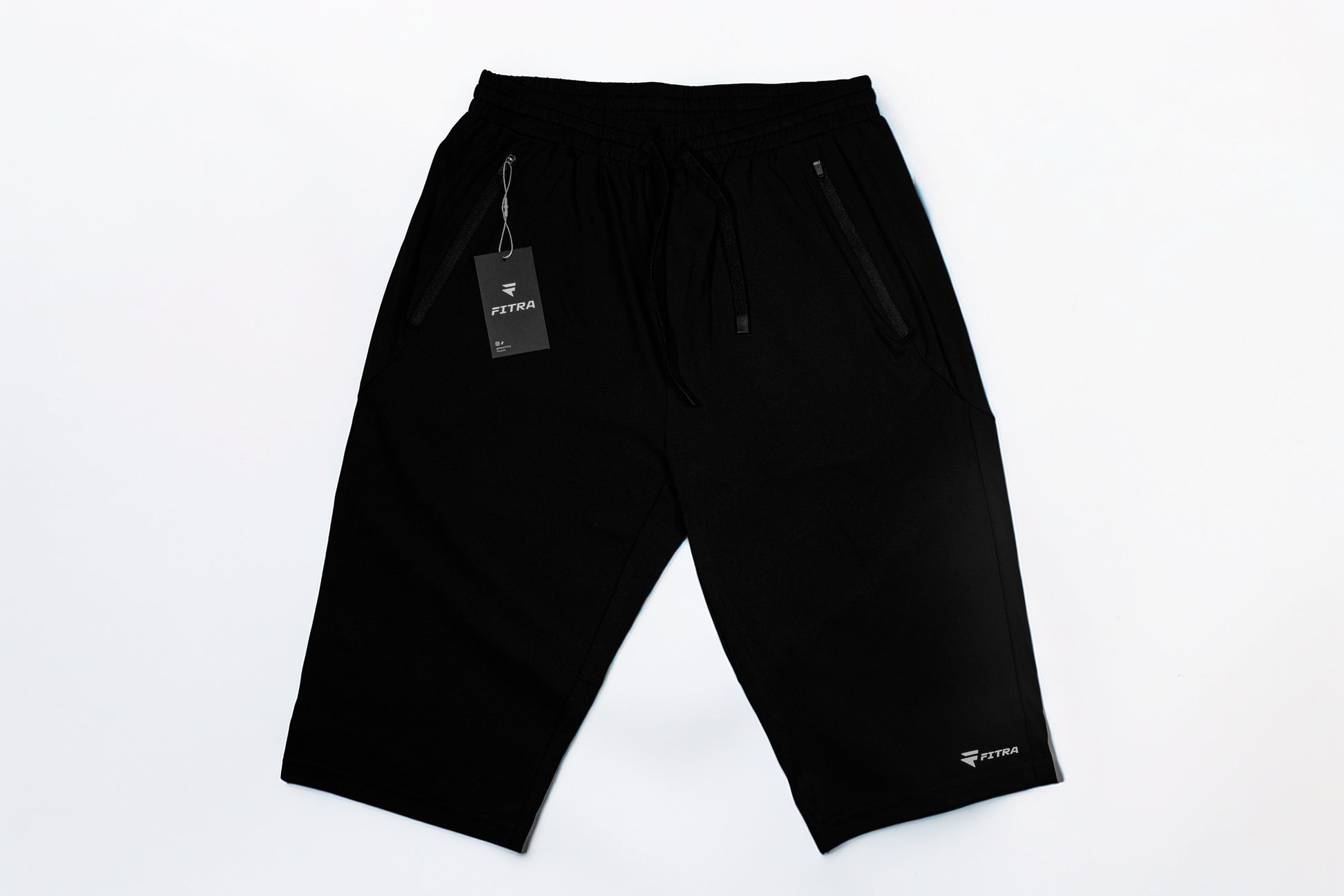 Fitra Core Short in black laid flat, full front view with 14 inch knee-length inseam